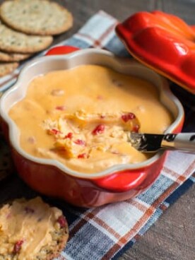 horseradish velveeta dip in a pumpkin shaped bowl
