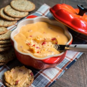horseradish velveeta dip in a pumpkin shaped bowl