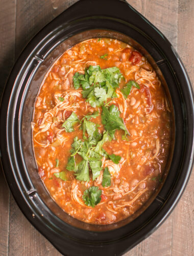 Mexican chicken soup with cilantro on top.