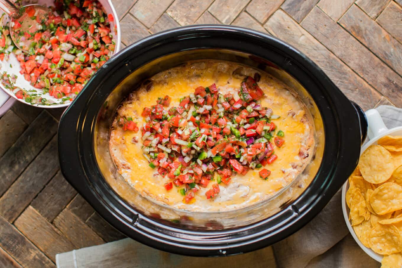 finished cooking ranch bean dip with salsa on top.