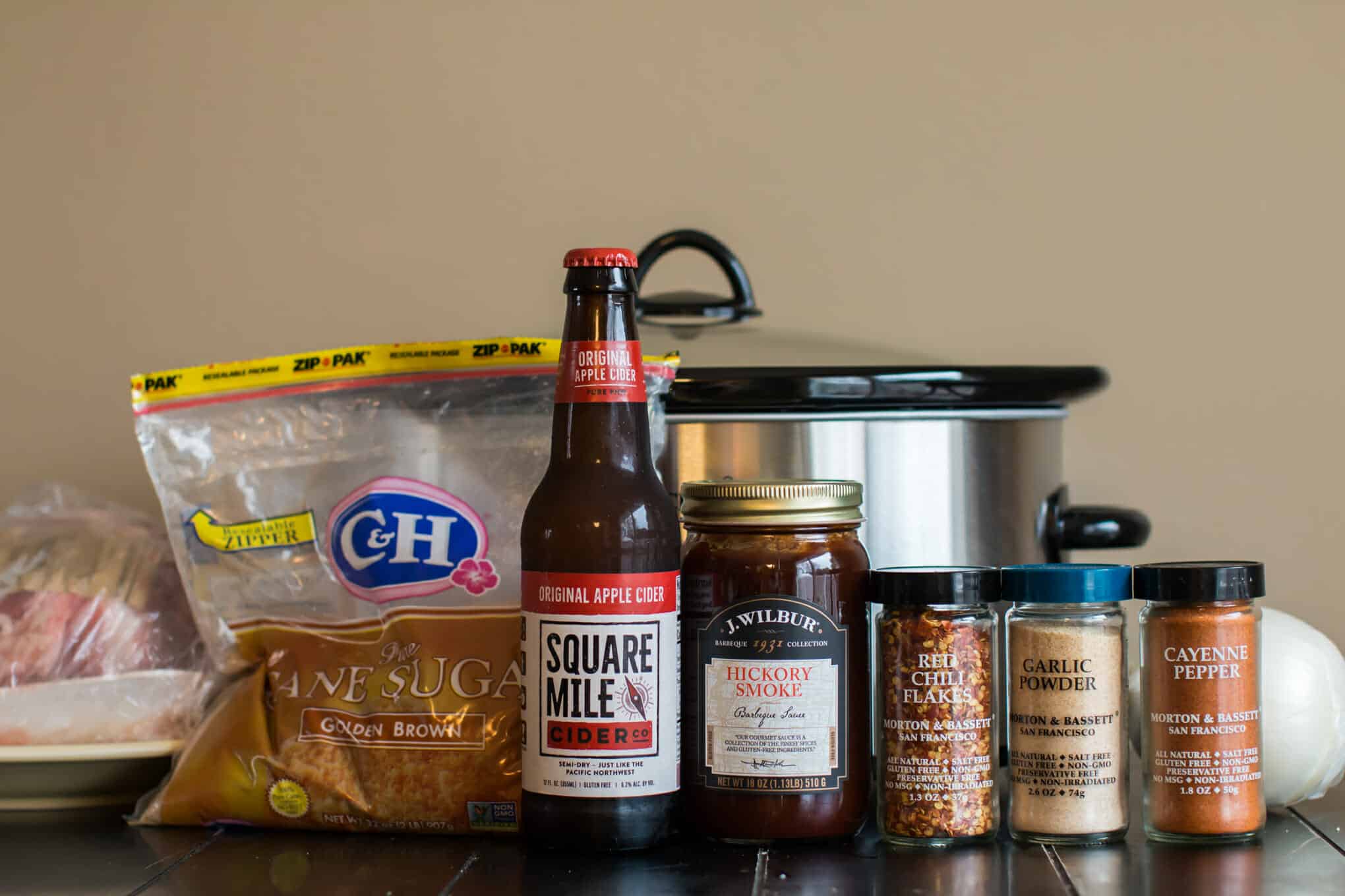 Pork, brown sugar, hard cider, barbecue sauce and seasonings with slow cooker.