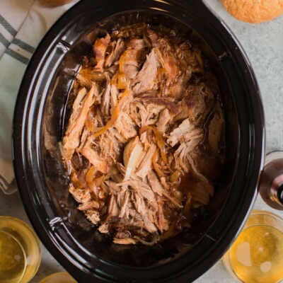 shredded pork with hard cider in glasses on the side.