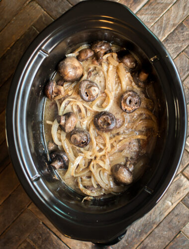 roast with onions, horseradish and mushrooms in a slow cooker