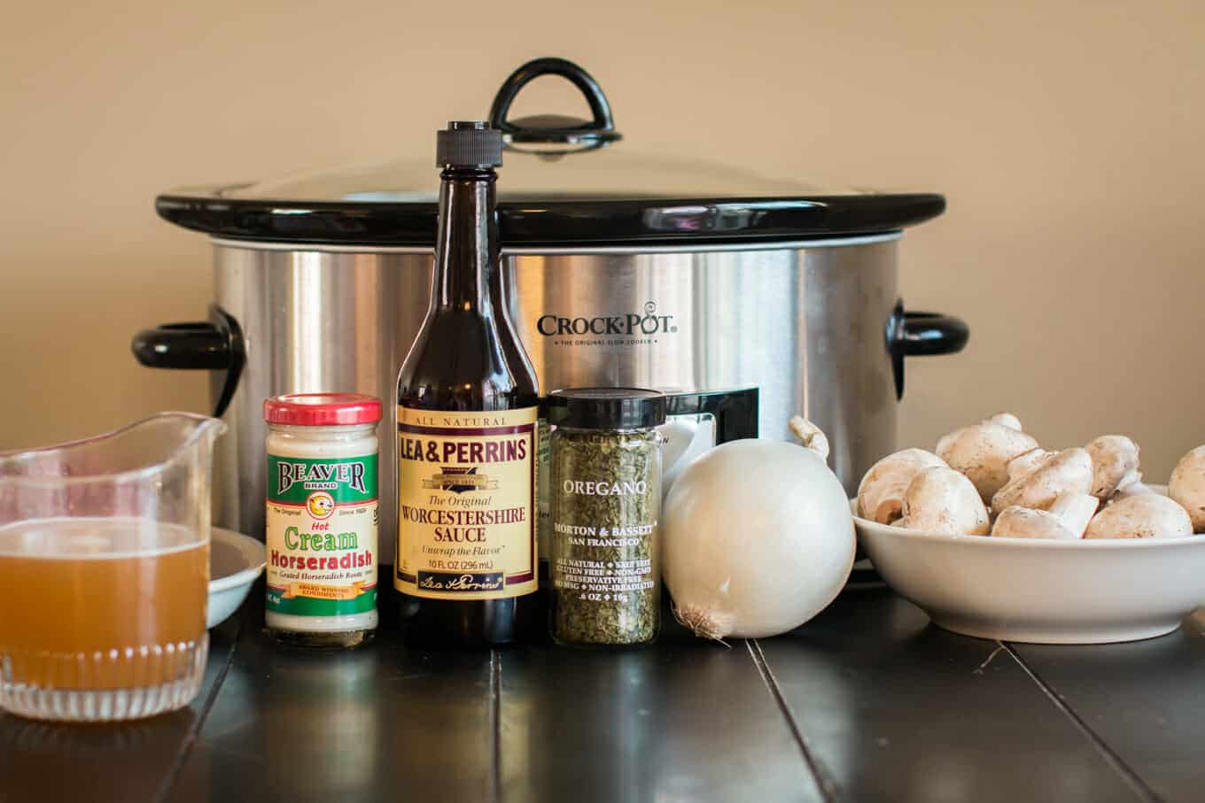 mushrooms, onion, oregano, Worcestershire sauce, beef broth, beef in front of a slow cooker