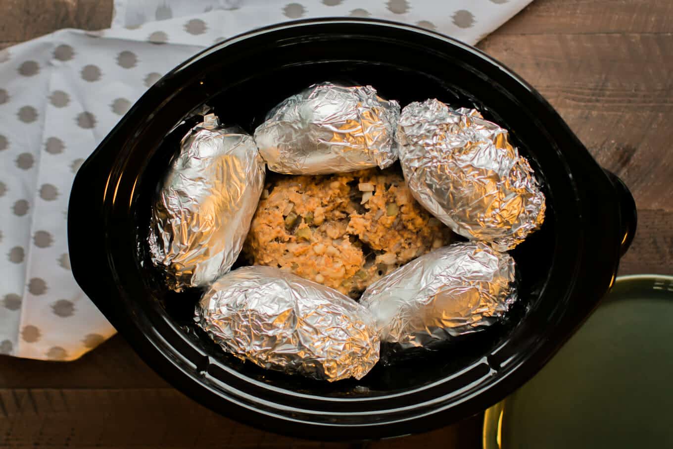 finished cooking meatloaf and baked potatoes in slow cooker