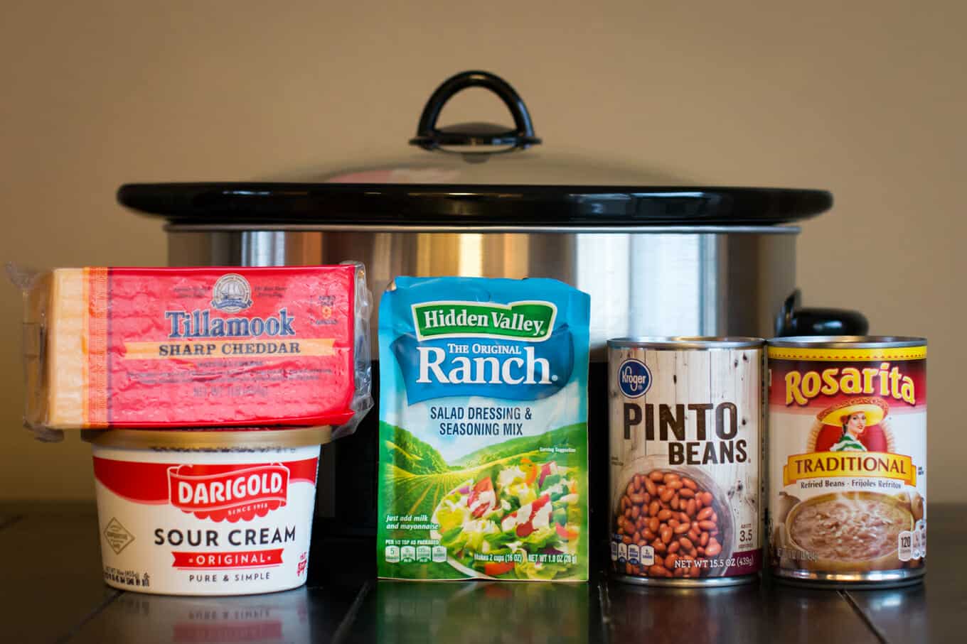 sour cream, pinto beans. refried beans, cheese in front of slow cooker