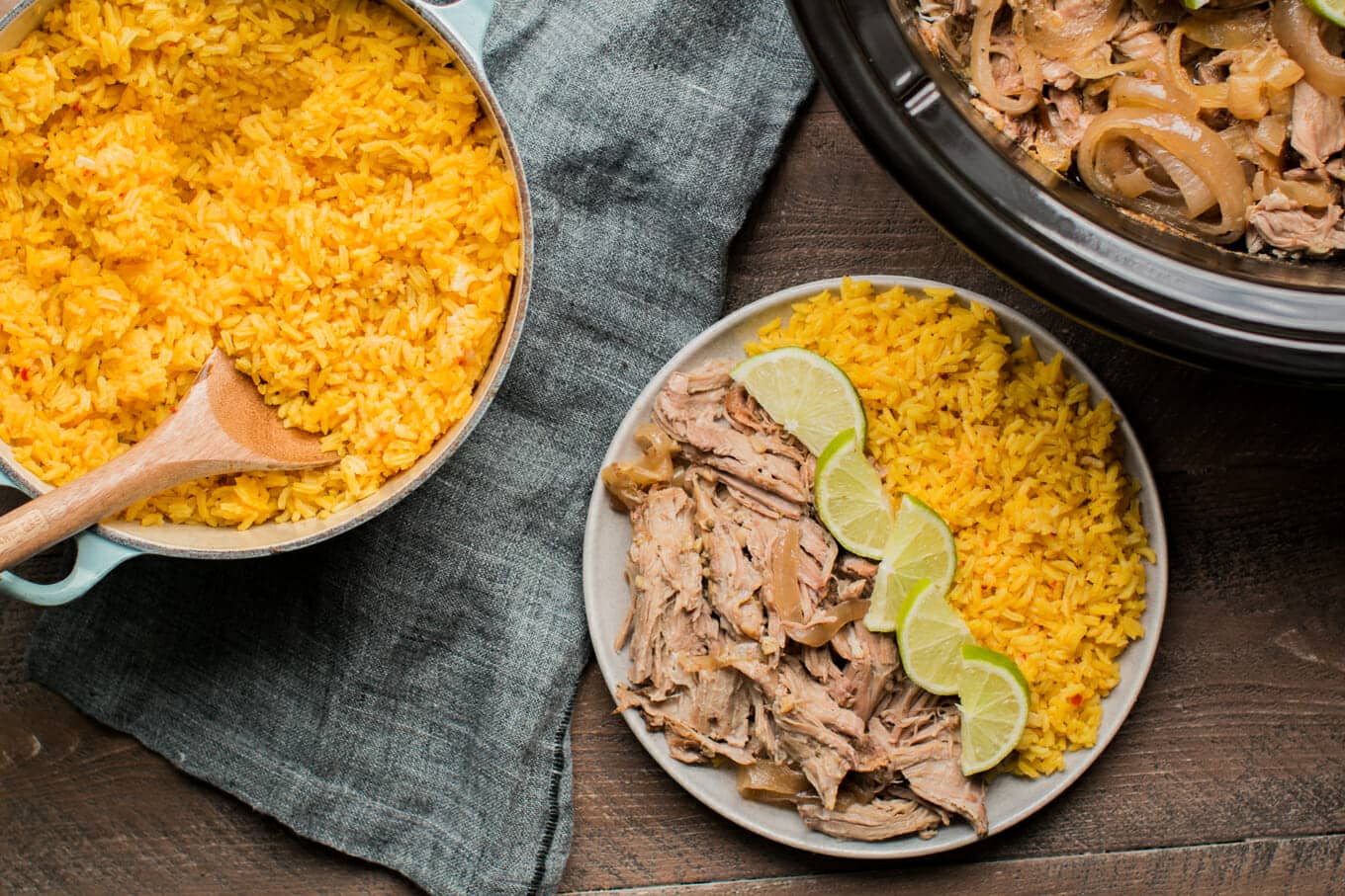 plate of cuban beef, limes and yellow rice.