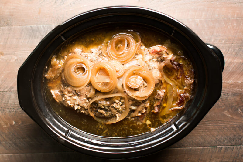 cuban pork in slow cooker before shredding.