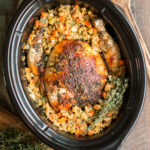 whole chicken in stuffing with thyme in the slow cooker