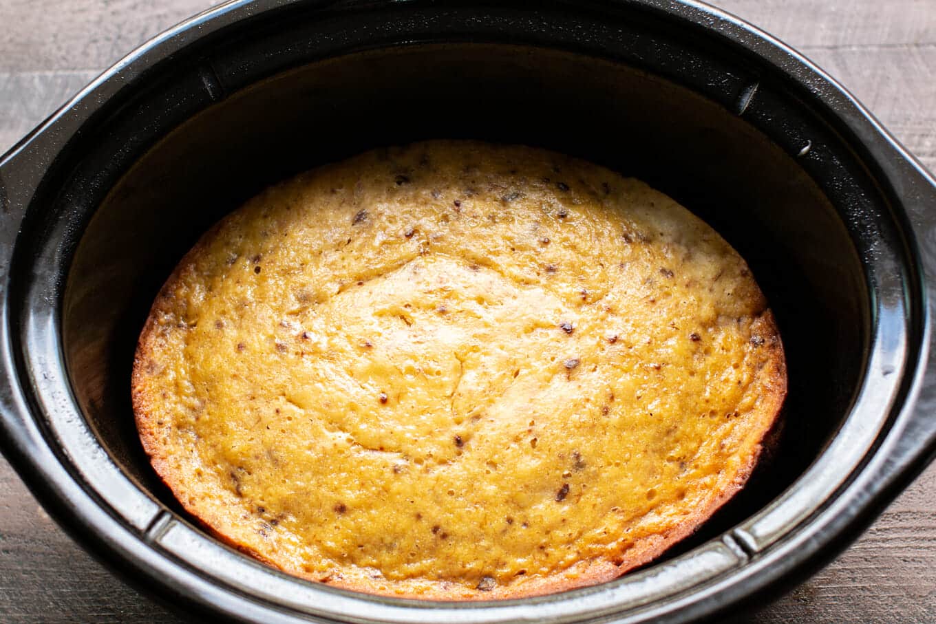 finished cooking banana cake in slow cooker, no frosting on it.