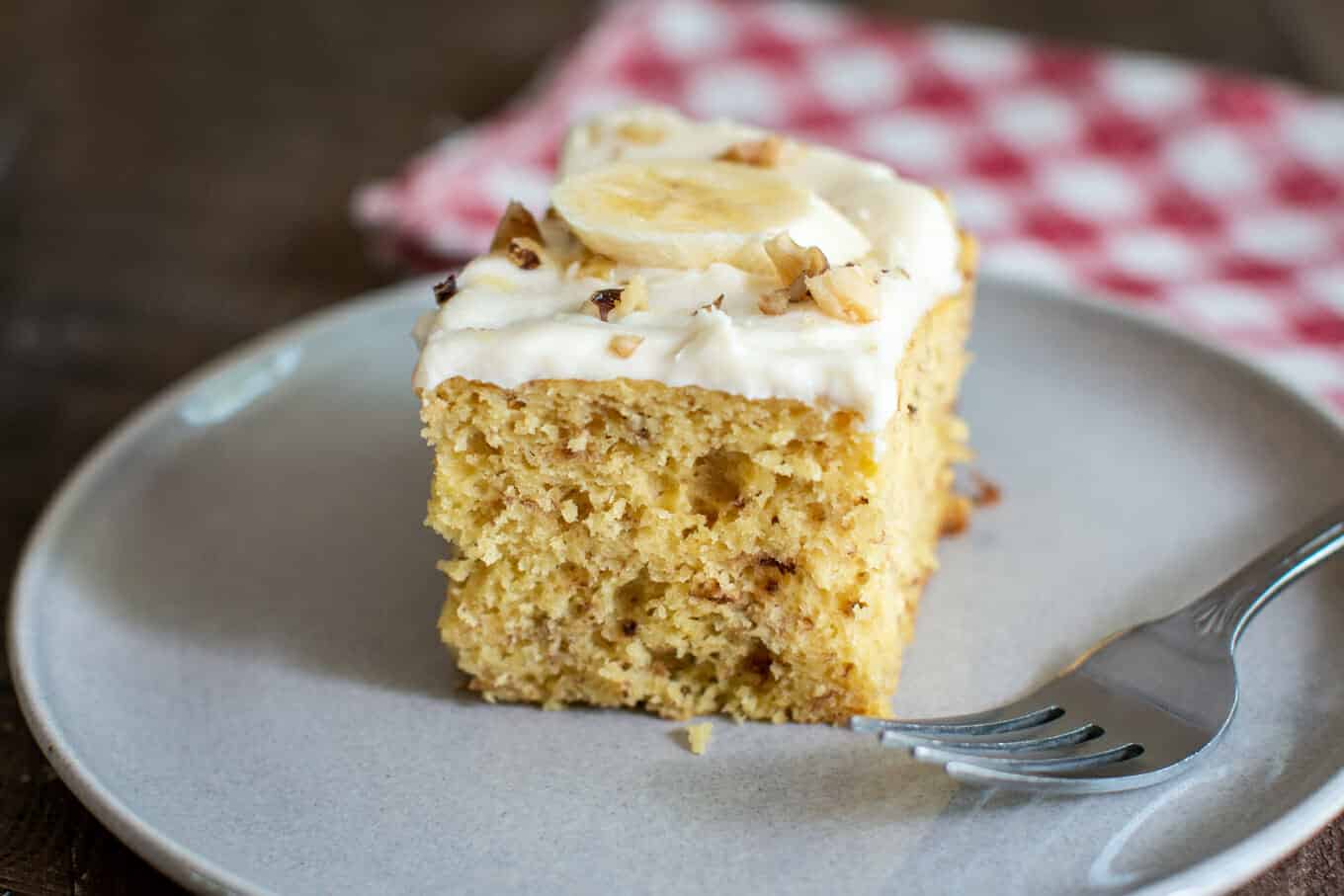 slice of banana cake on grey plate.