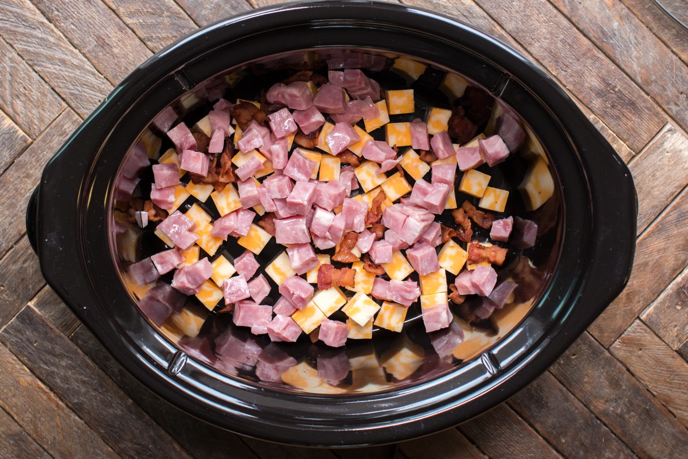 ham, bacon and cheese cubes in slow cooker.