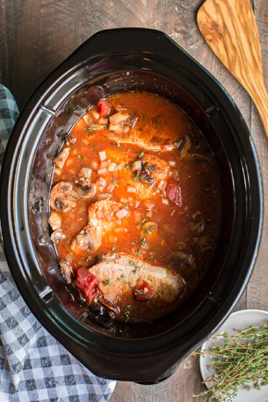 cooked pork chop cacciatore in slow cooker.