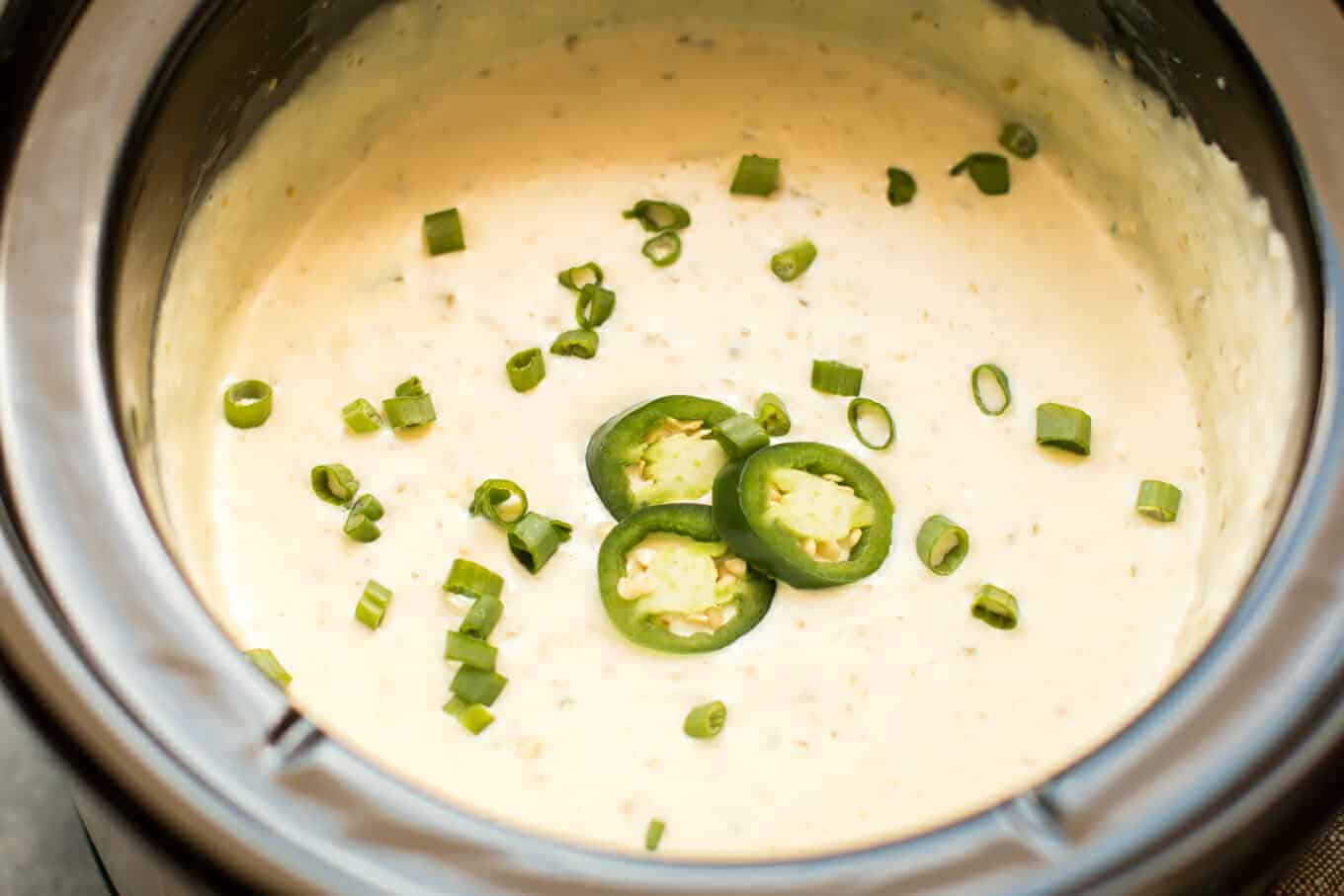 cooked white velveeta with chile verde salsa in slow cooker.