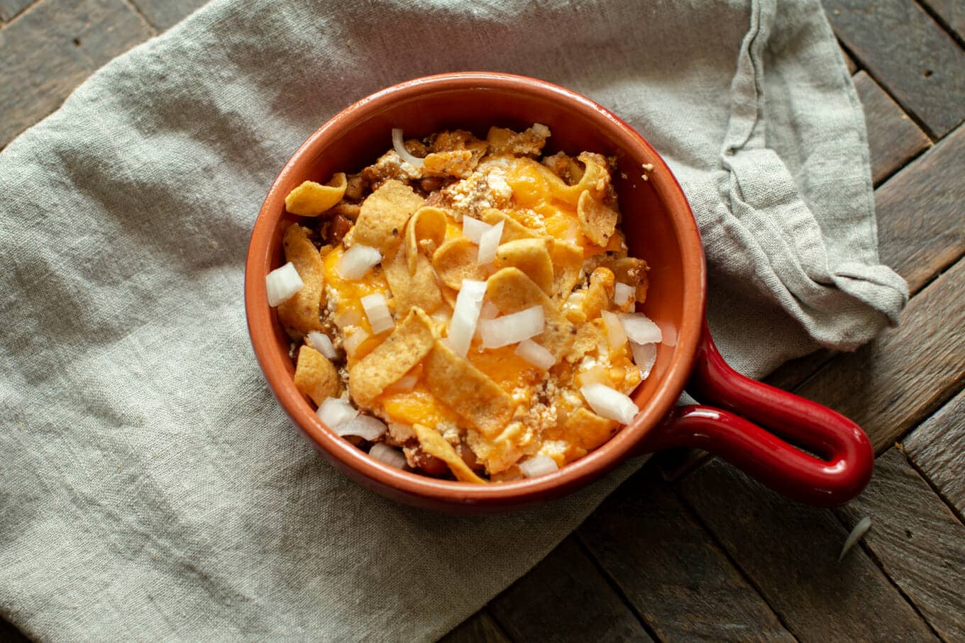 bowl with portion of chili cheese casserole.