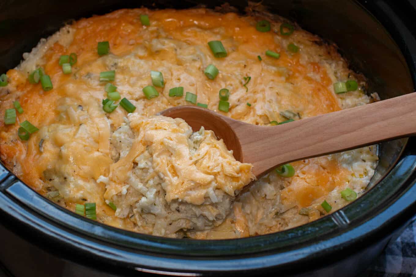 close up  of party potatoes in a slow cooker