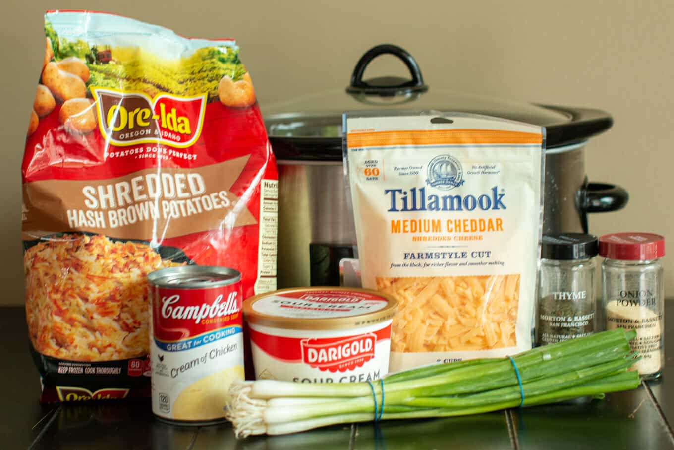 hashbrown potatoes, sour cream, cream of chicken soup, cheese and green onions.