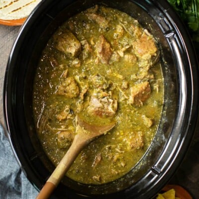 pork chunks cooked in slow cooker in a green chile sauce.