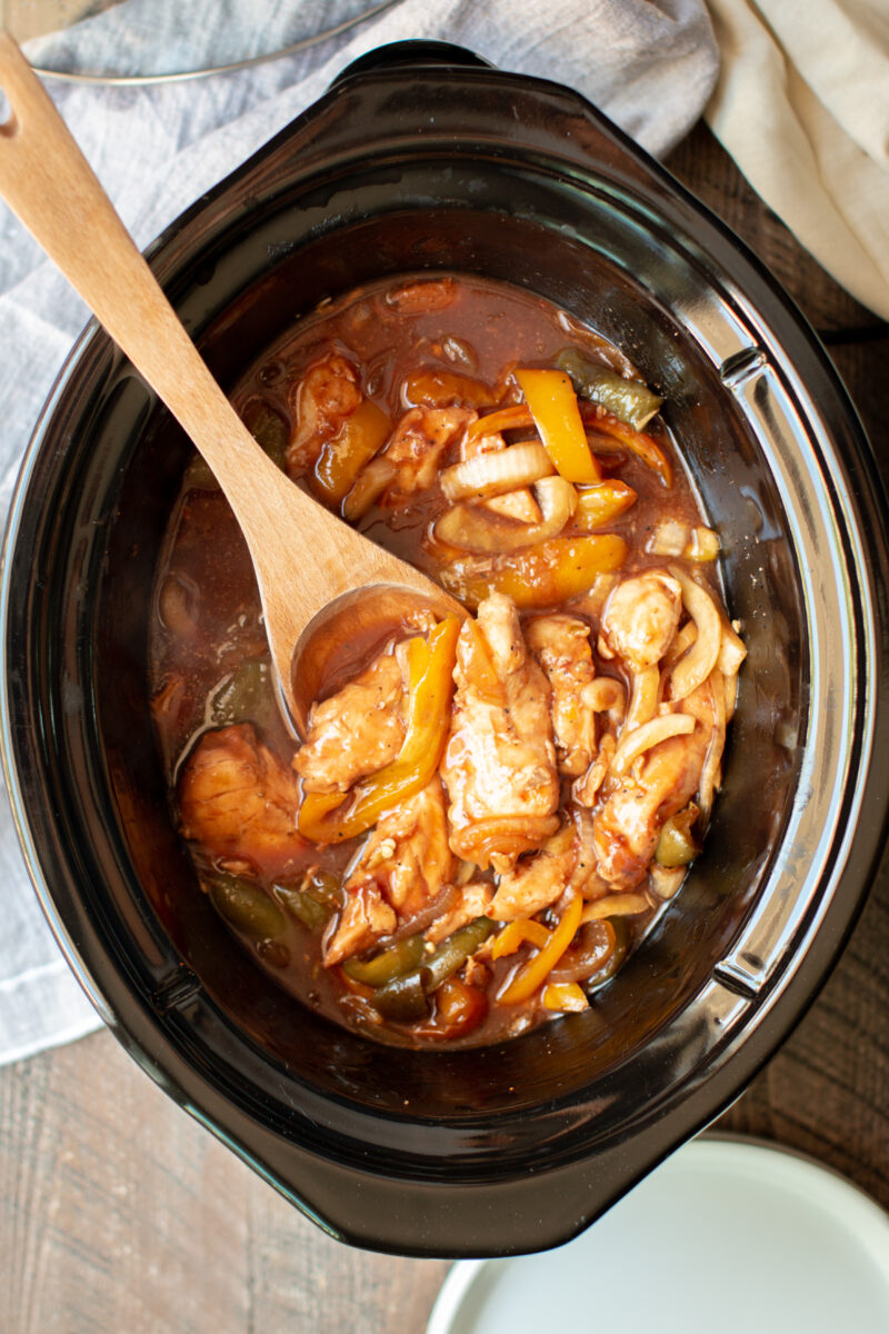 wooden spoon in barbecue chicken