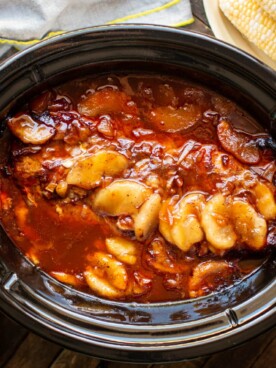 pork loin in barbecue sauce with canned apples cooked in slow cooker.
