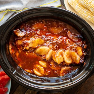 pork loin in barbecue sauce with canned apples cooked in slow cooker.