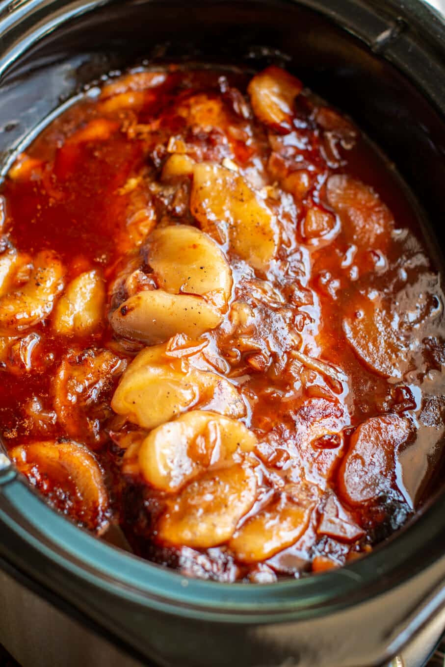 close up of apple barbecue pork loin in slow cooker.