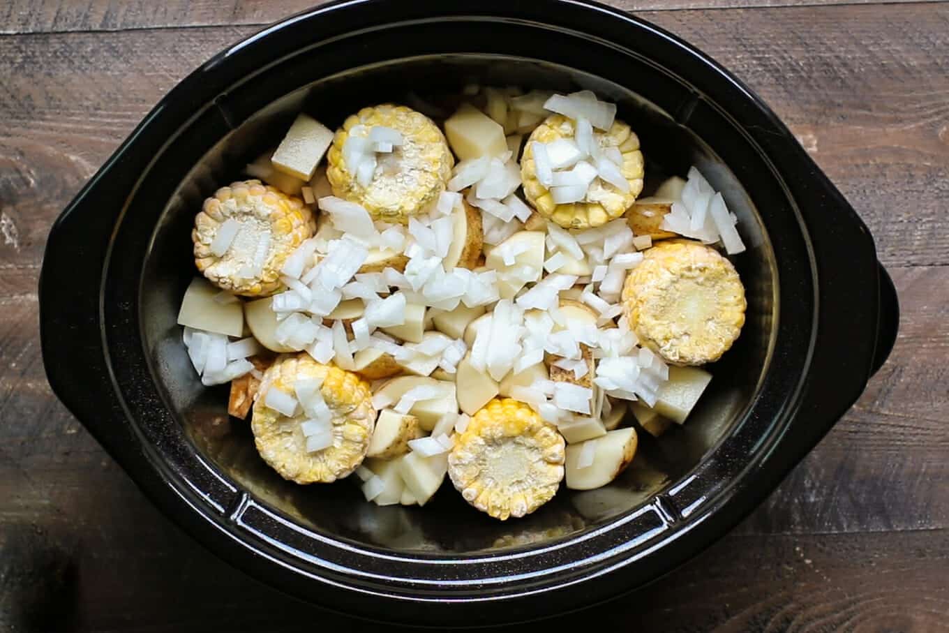 Corn, onions and potatoes in slow cooker