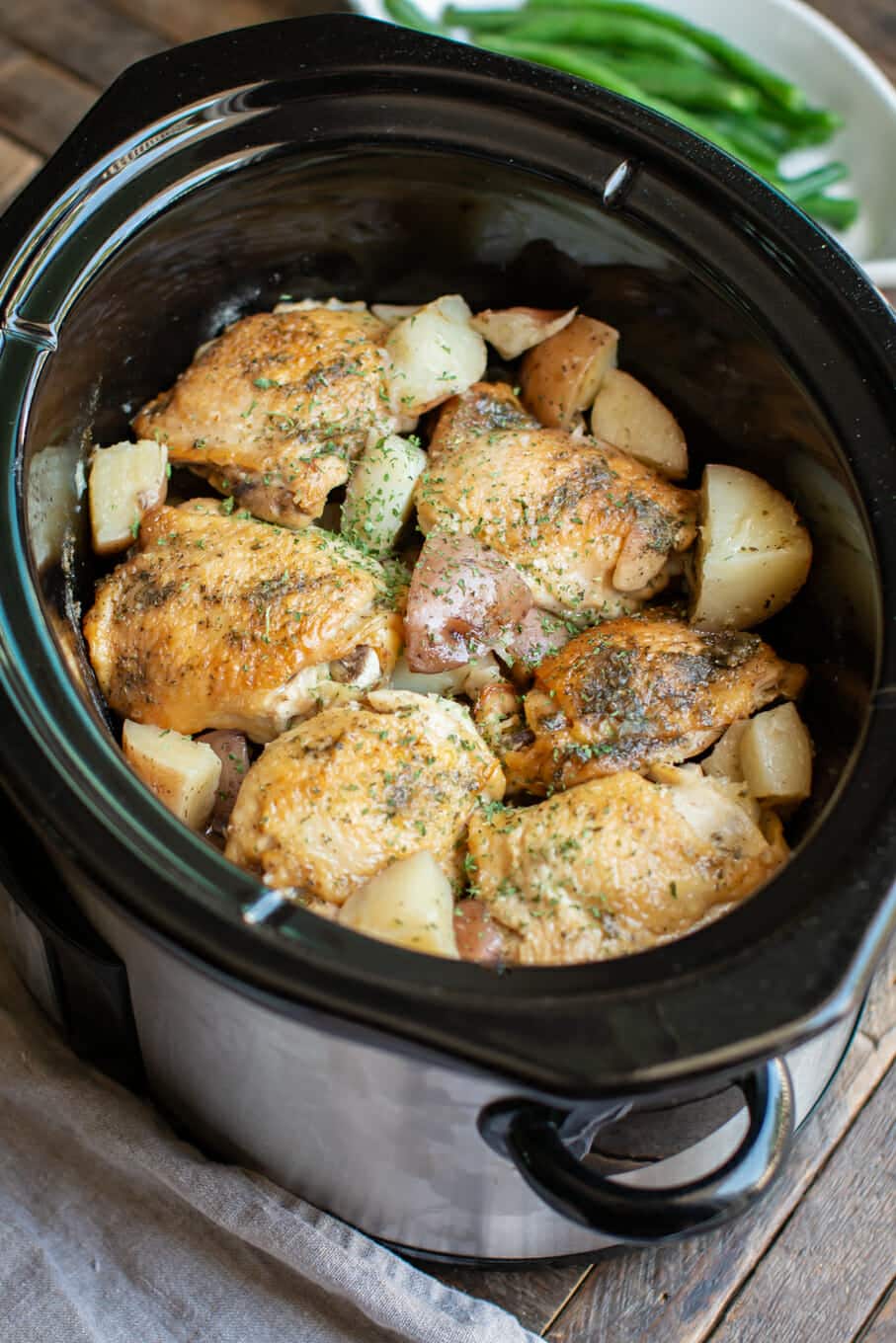 chicken thighs in the slow cooker with ranch and potatoes.