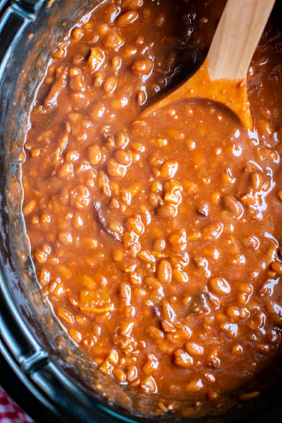 close up photo of root beer baked beans in slow cooker