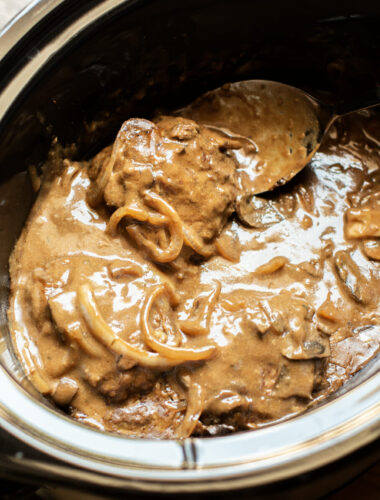 cooked salisbury steaks in gravy in slow cooker