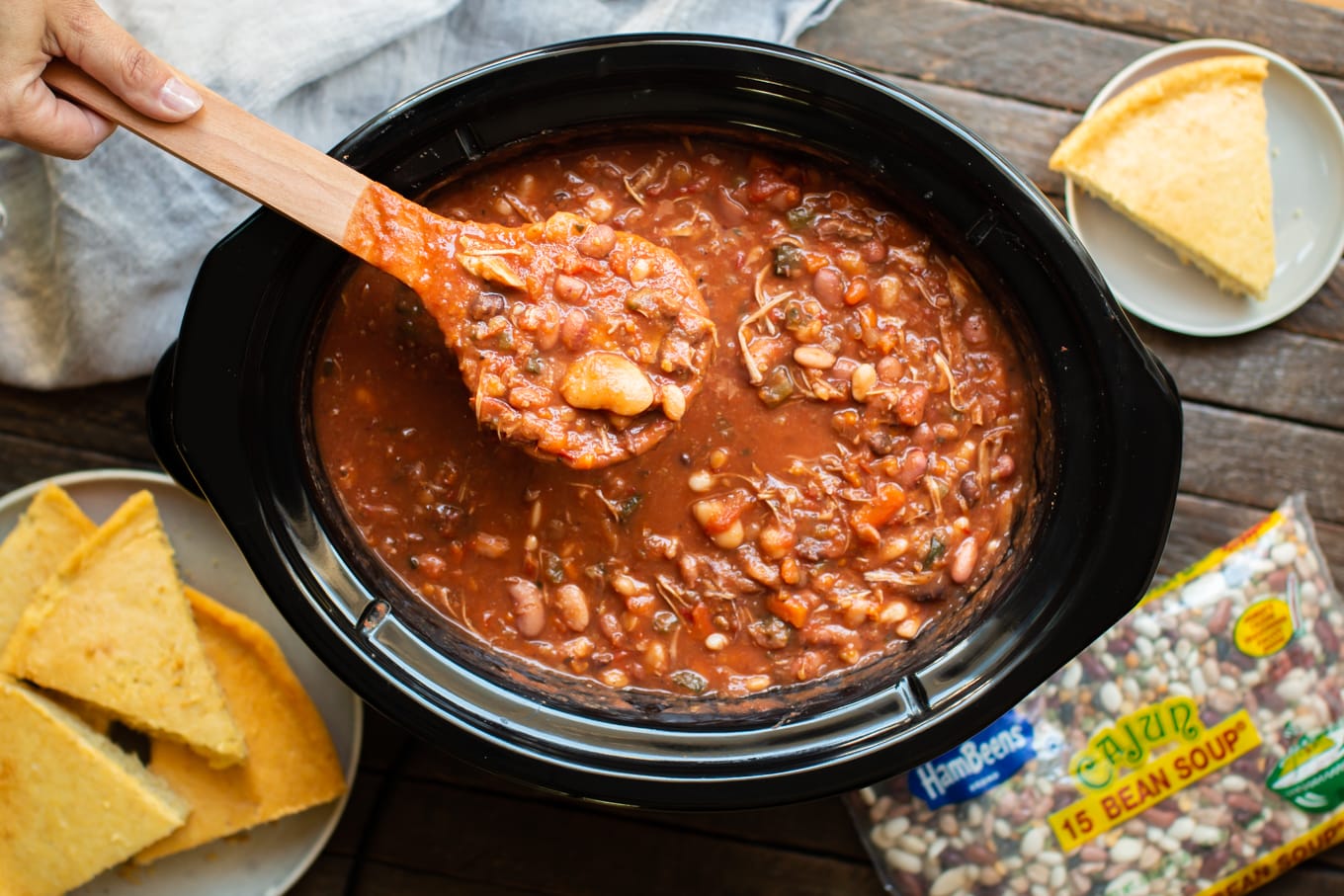 cajun 15 bean soup in a slow cooker with ladle full of soup