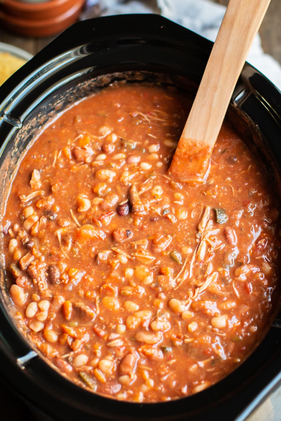 close up of cajun 15 bean soup in a slow cooker.