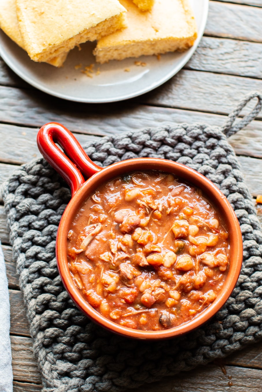 bowl of cajun turkey 15 bean soup in red bowl