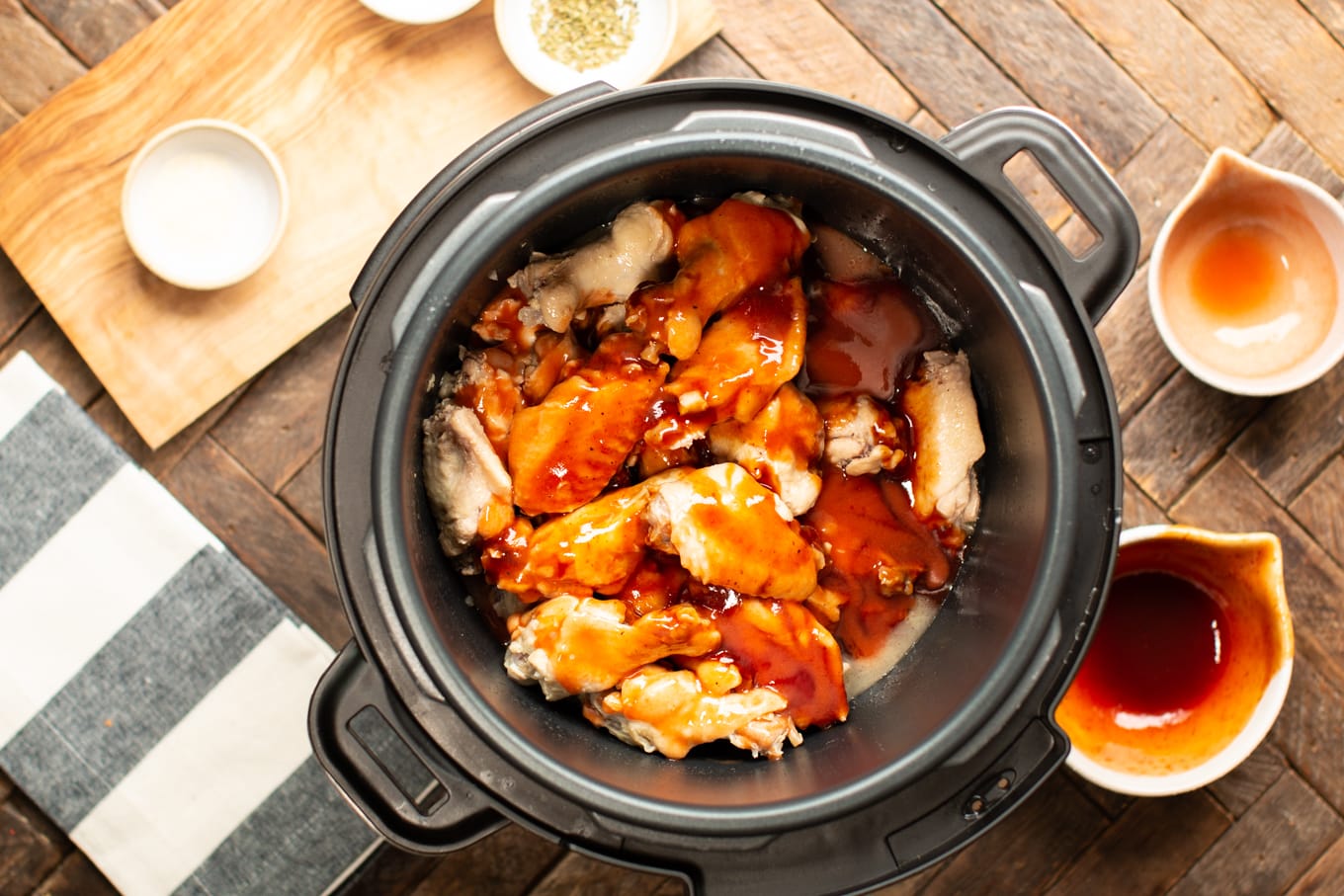 chicken wings in pressure cooker with barbecue sauce and buffalo wings sauce