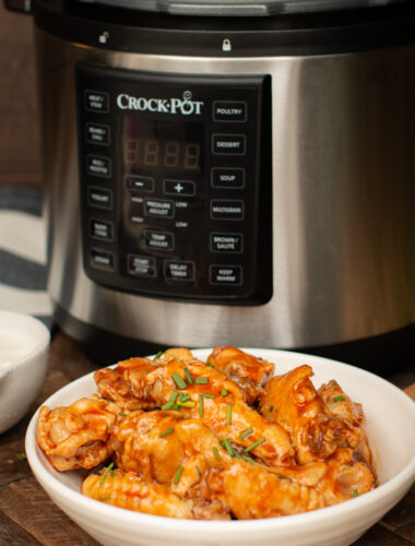 buffalo wings in front of a slow cooker