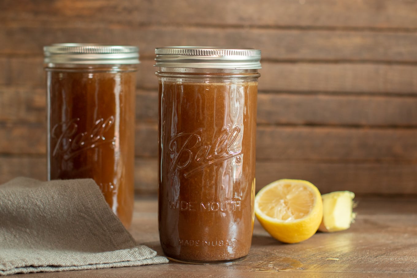 2 ball mason jars with beef bone broth in them.