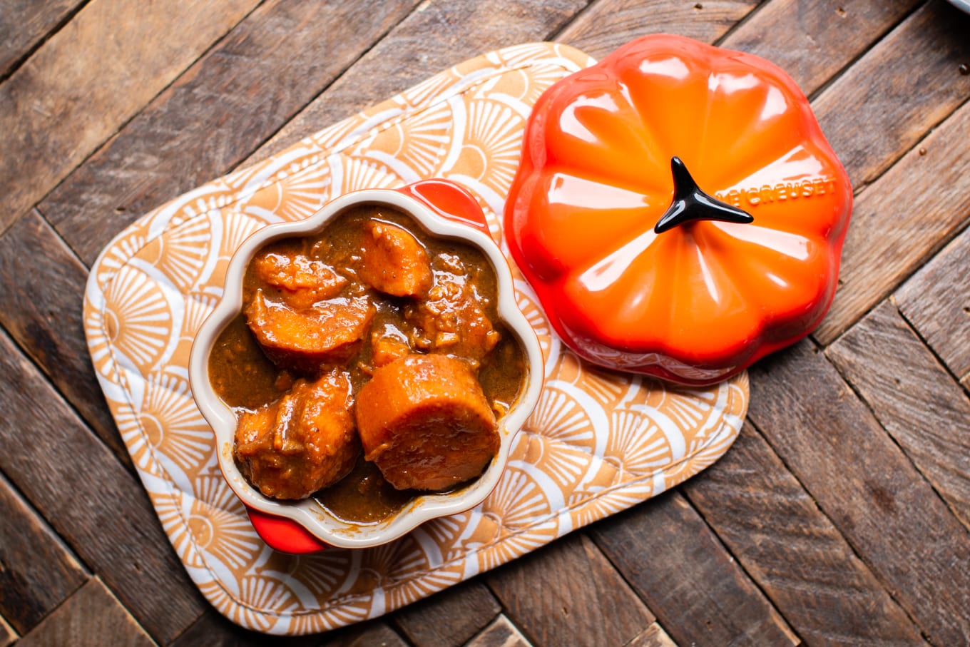 pumpkin shaped crock with yams in them.