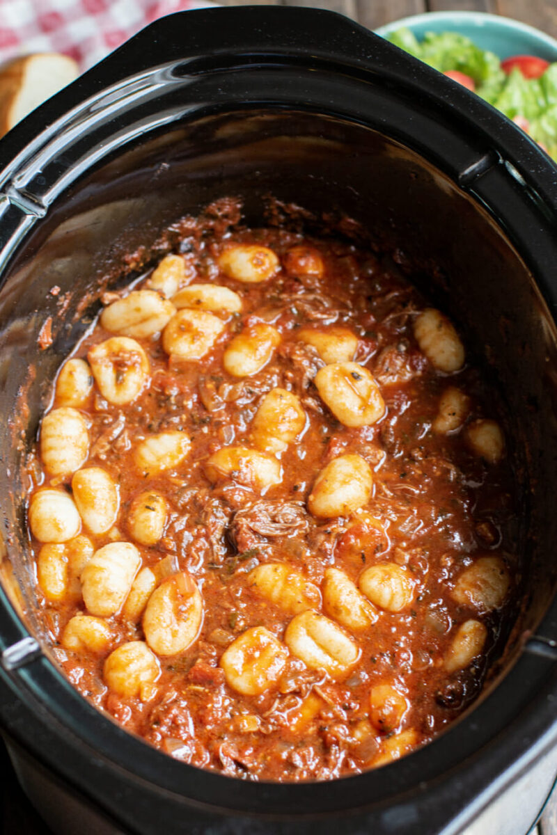 close up of short rib ragu in slow cooker