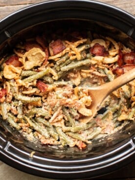 green beans in slow cooker with french fried onions on top