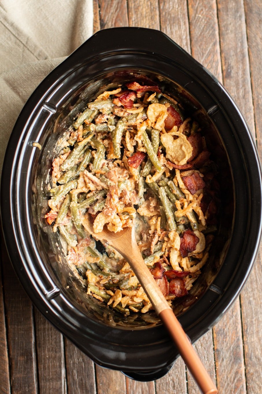 close up of bacon green bean casserole in slow cooker