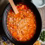 soup with buffalo sauce, carrots and variety of beans in a slow cooker.
