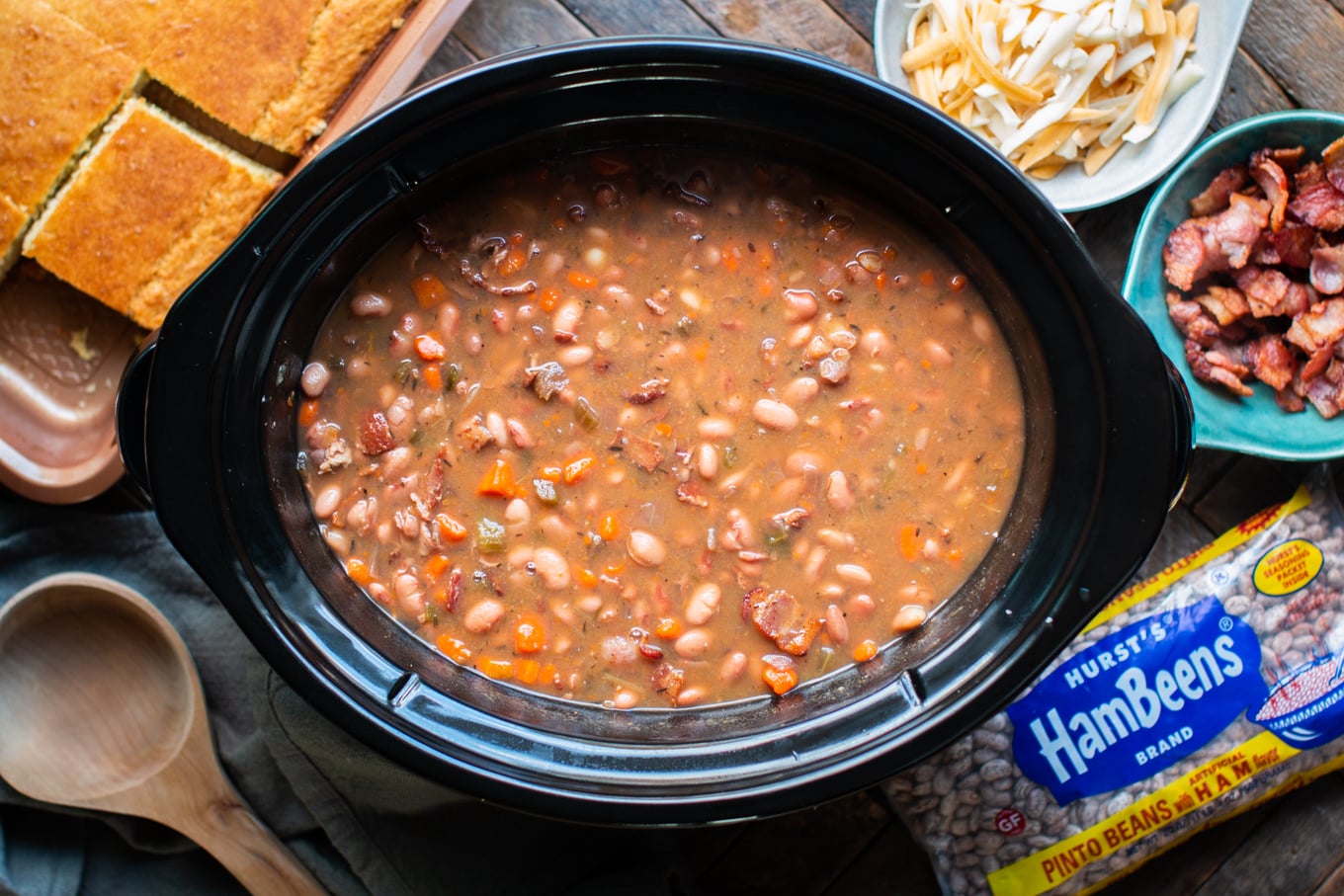 pinto beans and bacon cooked in slow cooker with cheese and cornbread.