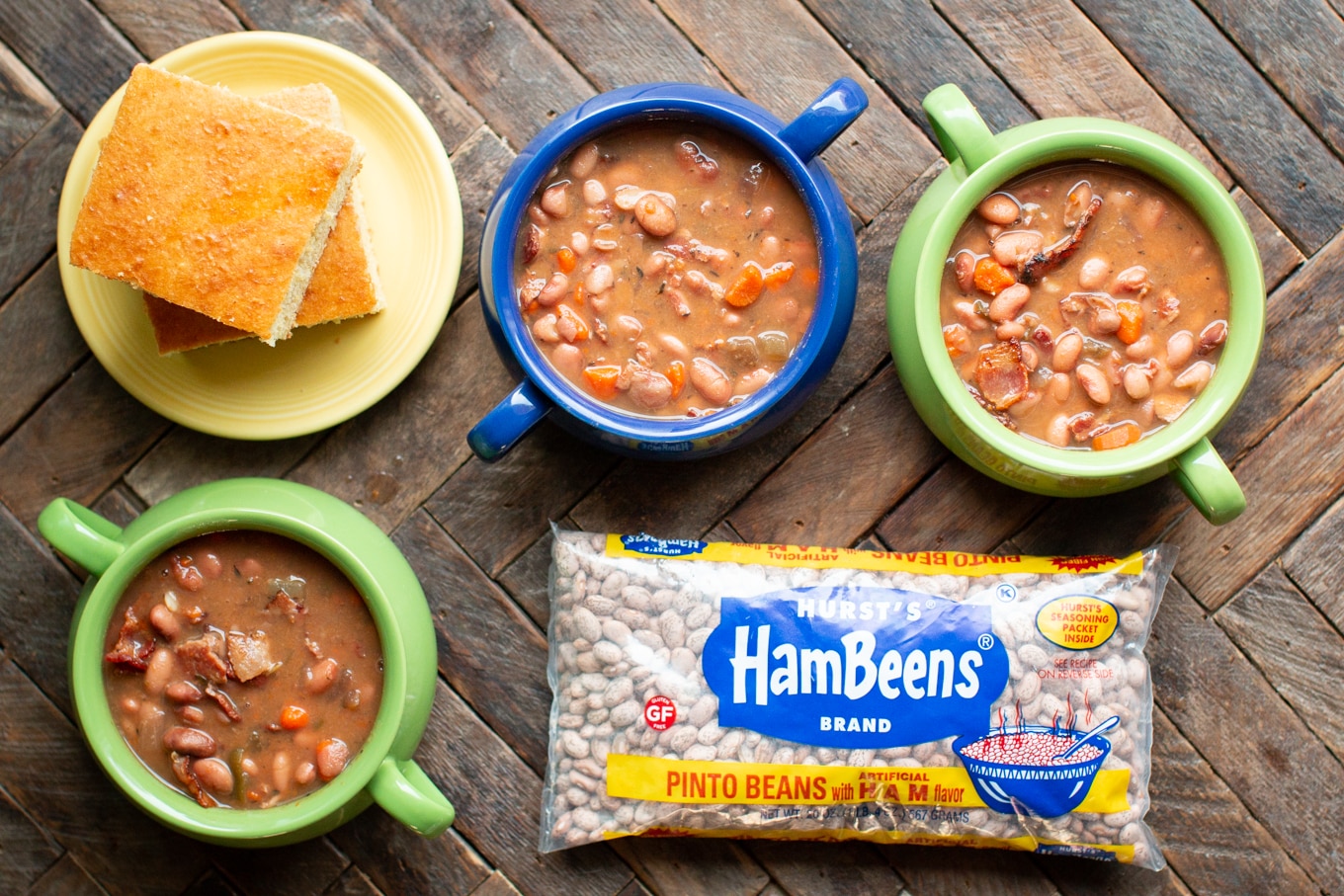 3 bowls of pinto beans with cornbread and bag of HamBeens pinto beans with ham flavor.