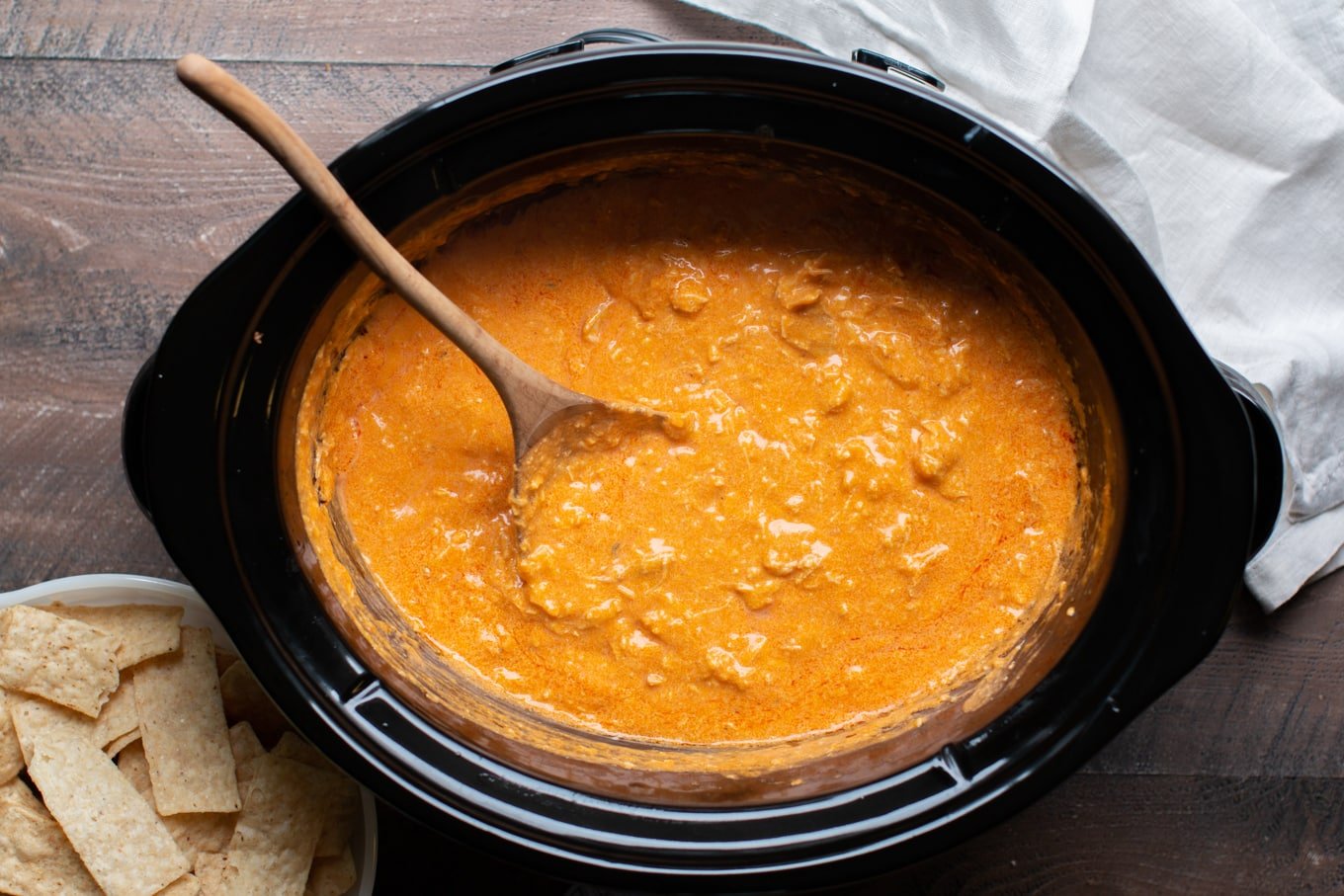 creamy buffalo chicken dipped cooked in a slow cooker.
