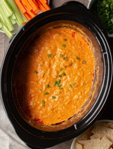 buffalo dip with green onions on top.