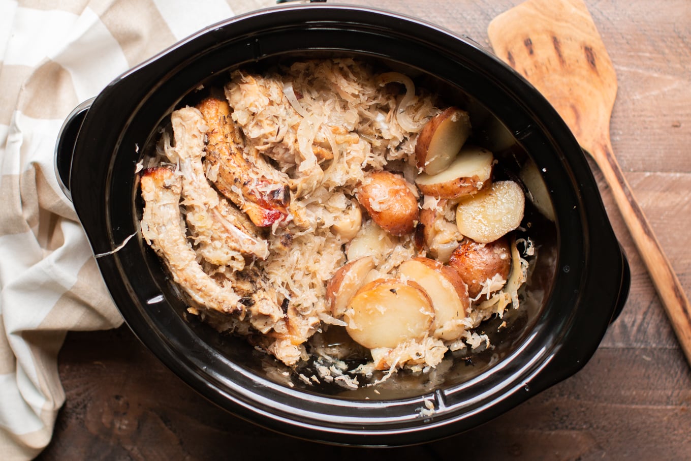 ribs, potatoes and sauerkraut cooked together in a slow cooker.