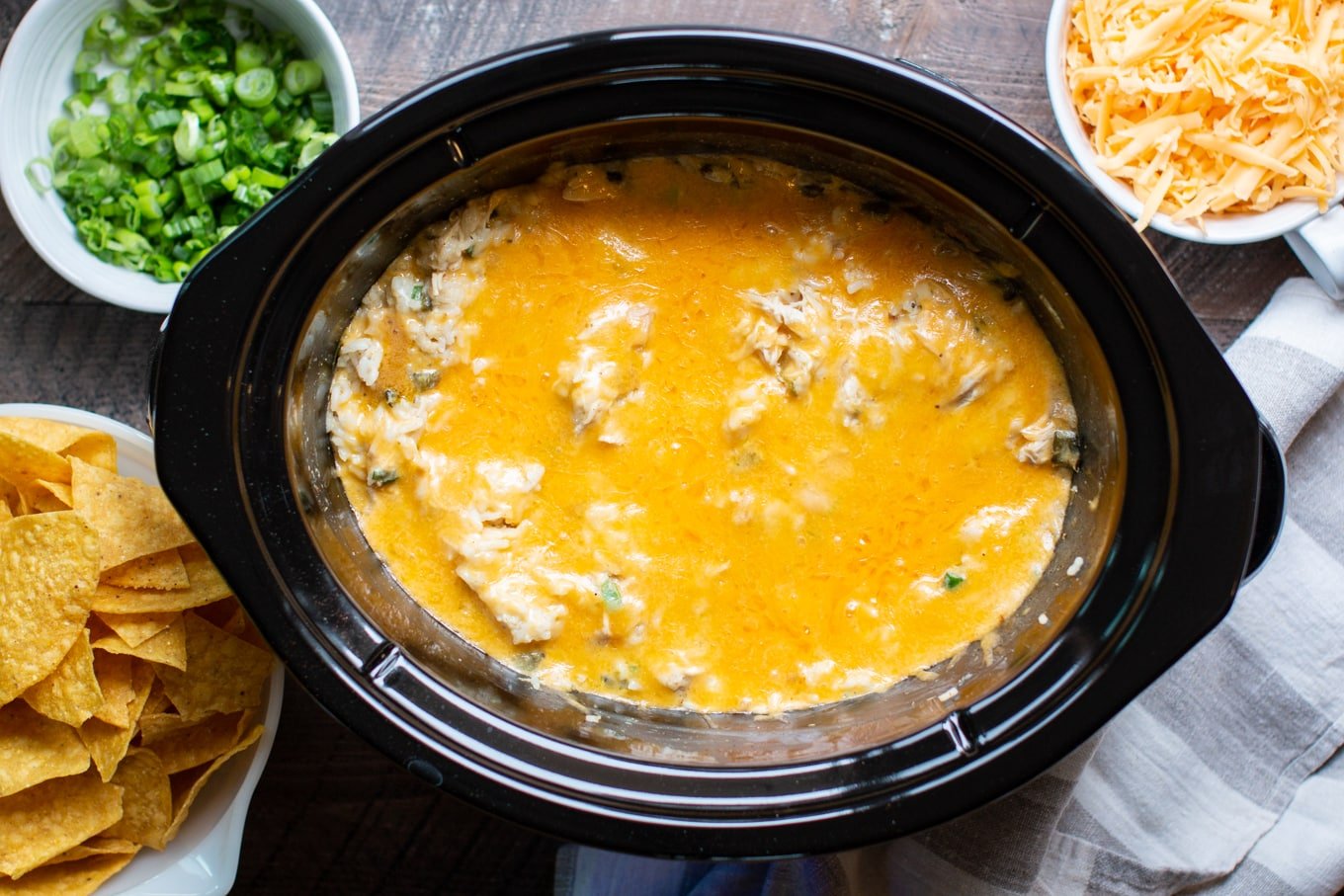 casserole in a slow cooker with melted cheese on top.