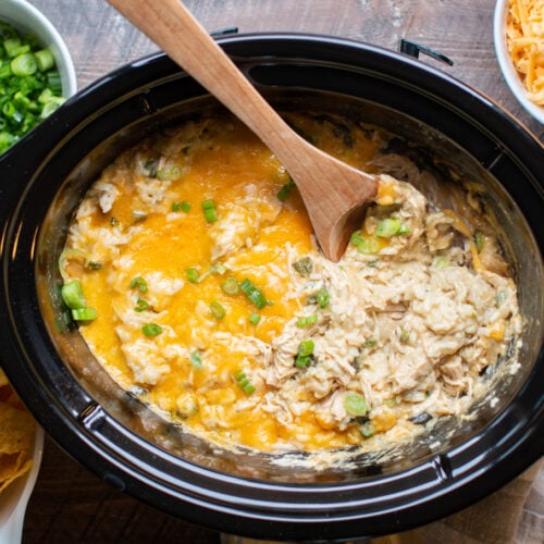 rice casserole with green chiles and chicken in a slow cooker.