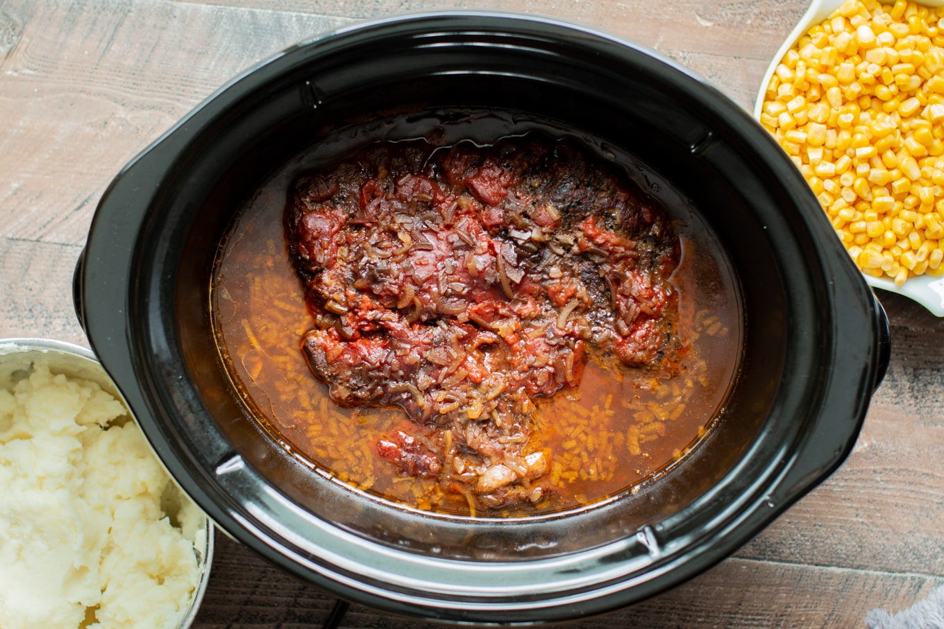 Cooked pot roast in slow cooker, not shredded.