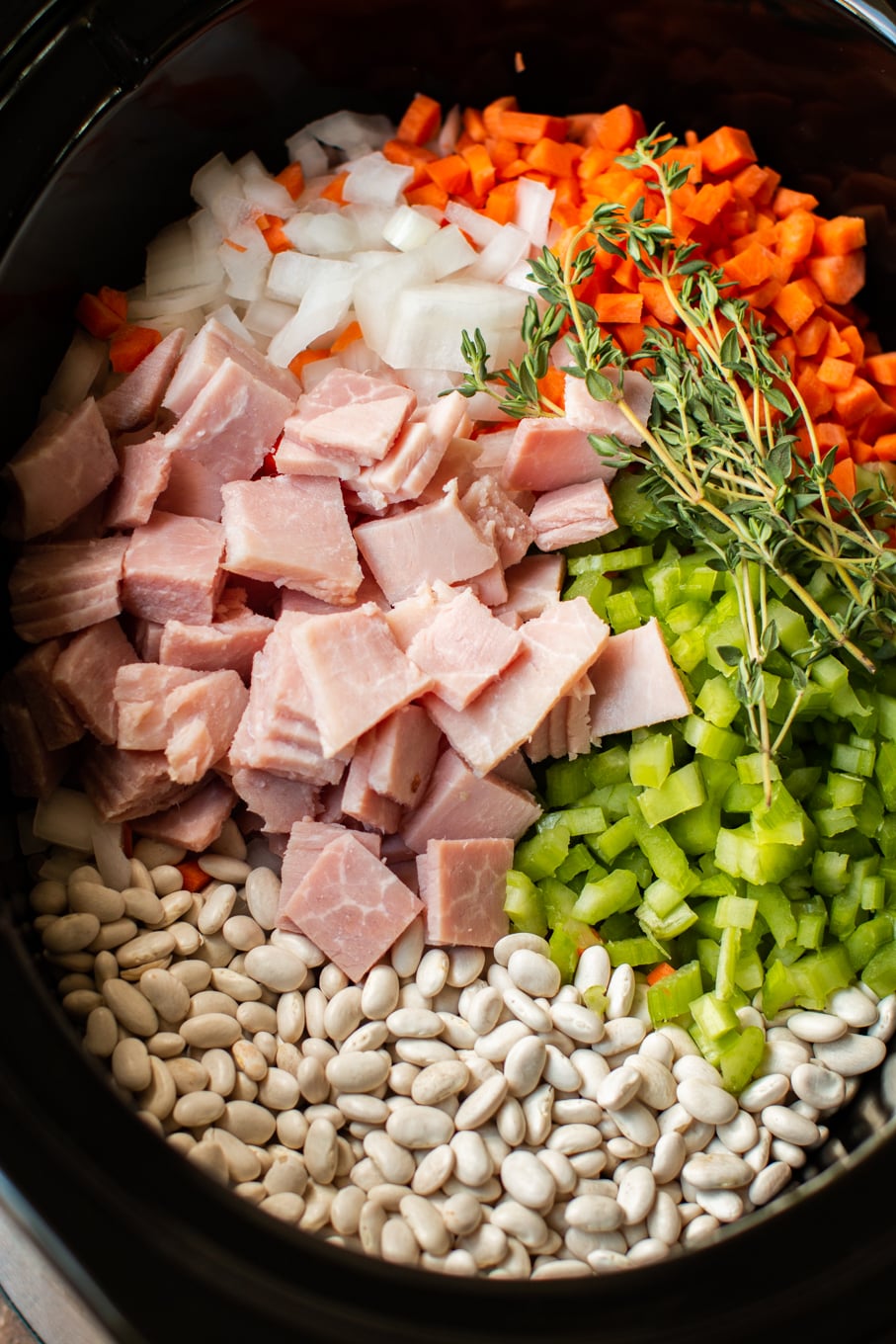 Ingredients for ham and beans in crock pot raw.